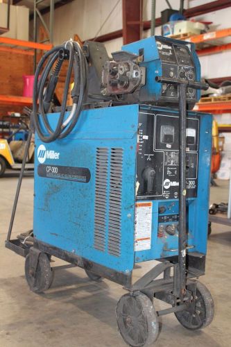 Miller cp-300 welder with a wire feeder for sale