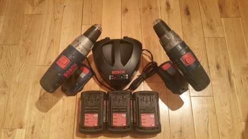 Two Bosch 36 Volt Hammer Drills, three 36 volt batteries, and one36 volt charger