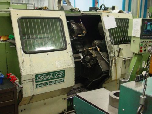 15.74&#034; swg 29.52&#034; cc okuma lc-20/2sc cnc lathe, osp 5000l, 4-axis, 8&#034;chk., tails for sale