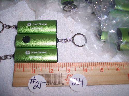 36 NEW JOHN DEAR GREEN FLASHLIGHT KEY CHAINS WITH BATTERYS NICE BULK LOT DEAL