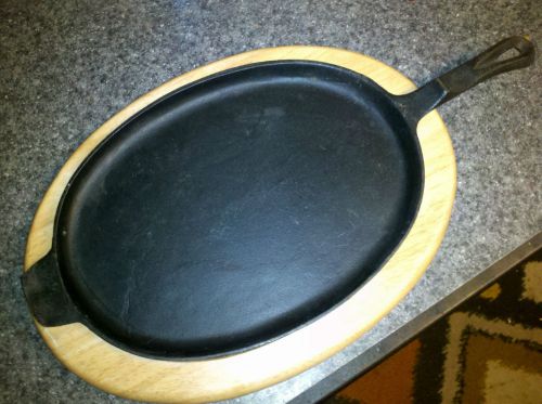 Dansk design cast iron sizzling steak plate fajita platter with wooden base for sale