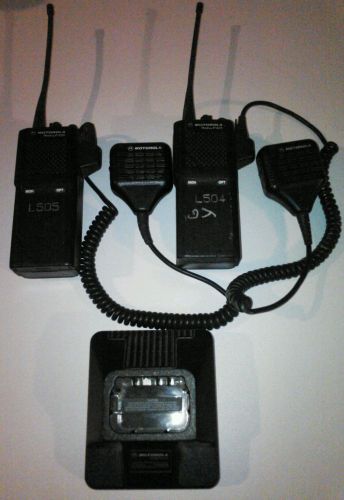 Lot of two motorola p1225 handhelds, 1 charging cradle no charger for sale