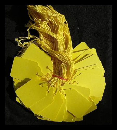 100 yellow strung price tags 42 x 27 mm traditional tie on swing tags free post for sale