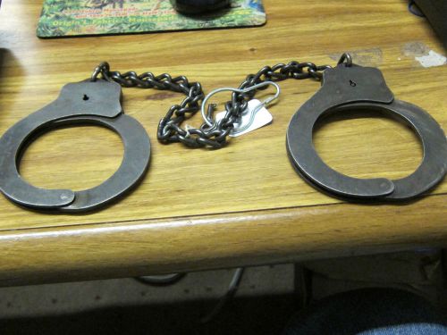 Vintage pair of Harvard Lock Co., Leg Cuffs, with key