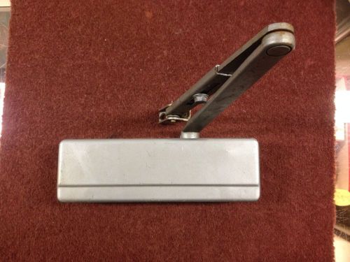 Door closer, heavy duty parallel arm cast iron used in good condition (lot 1) for sale