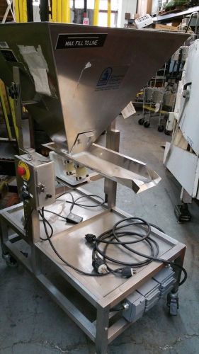 Vibratory feeder dispenser stainless on wheels. creative design. appears unused. for sale