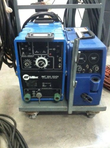 MILLER XMT 200 INVERTER DC POWER SUPPLY WITH MILLER WIRE FEEDER , SPOOLGUN AND M