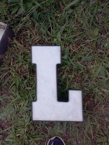 White acrylic face Channel Letter black trim and exterior Upper Case &#034;L&#034;