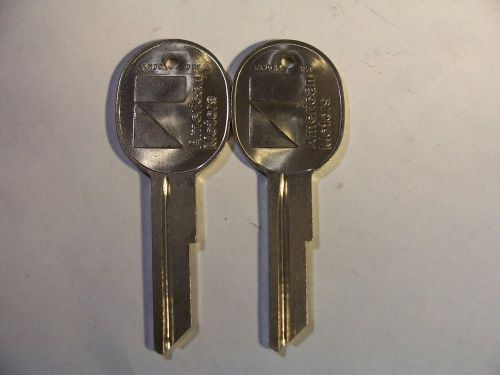 2  AMERICAN MOTOR  OEM   KEY BLANK  WITH KNOCKOUT IN PLASE  UNCUT   ORIGINAL