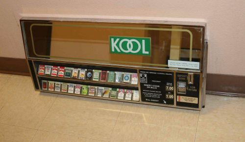 An old vintage cigarette vending machine selection panel assembly
