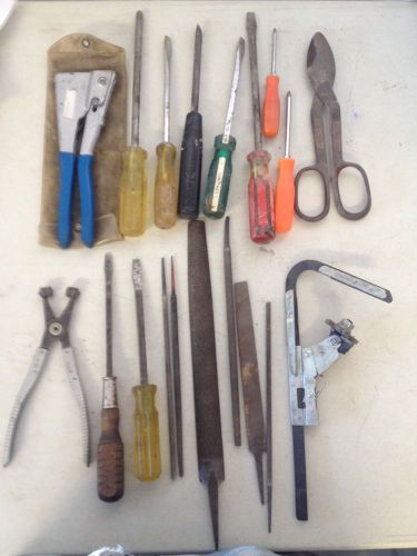 Metal Shears 9 Screwdrivers 1 Hand Press 1 CTA Clamp 6 Files Rivot Tool.