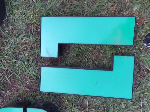 Green Upper Case &#034;L&#034; channel letters, black trim, black channel