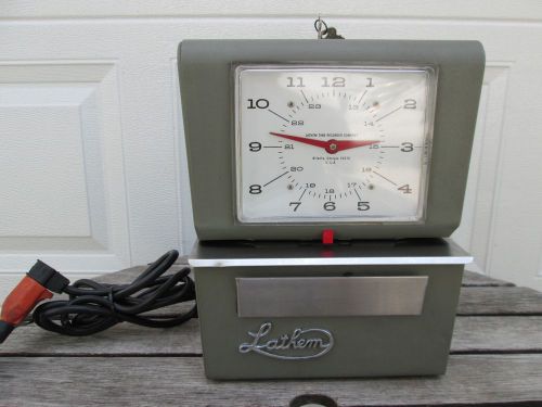 VINTAGE LATHEM TIME RECORDER CO.. CLOCK, MODEL 4076, WORKS WITH 2 KEYS