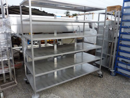 Heavy duty stainless steel rack with 6 shelf’s on swivel casters