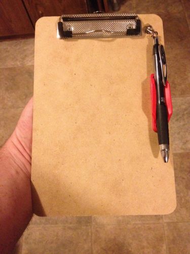 Clipboard with retractable pen/pen holder