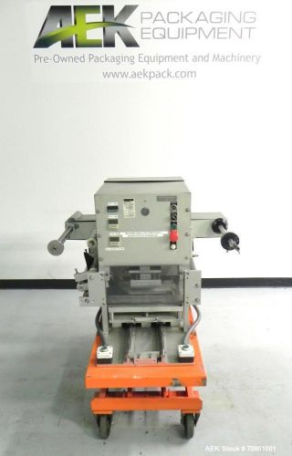 Used- orics model m-10 tray sealer. manual load unit capable of speeds up to 10 for sale
