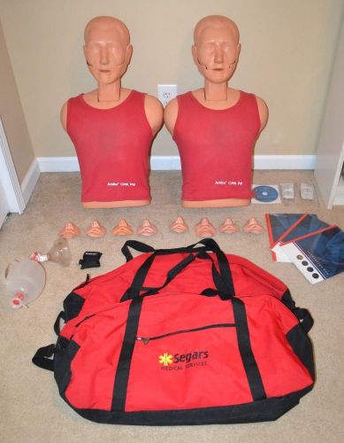 LOT OF 2 AMBU CPR PAL MANIKIN W/ 8 FACE MASKS, CARRYING BAG, BVM Ambu Bag, Etc.