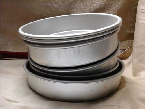 Wilton and Magic Line round cake pans.  (6) 8, 9 and 10 by 2 inches