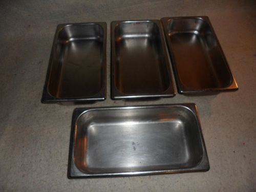 four stainlees steel steam table pans