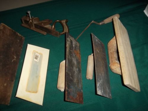 vintage antique plane and wooden concrete trowels