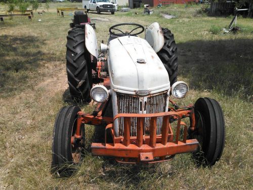 Farm and garden 8 N Ford Tractor with Grass cutting attachment.