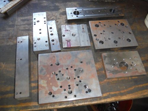 Pile of steel metal plate setup jigs fixtures from shop with moore jig grinder b for sale
