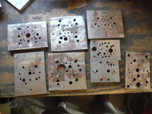 Pile of steel metal plate setup jigs fixtures from shop with moore jig grinder a for sale