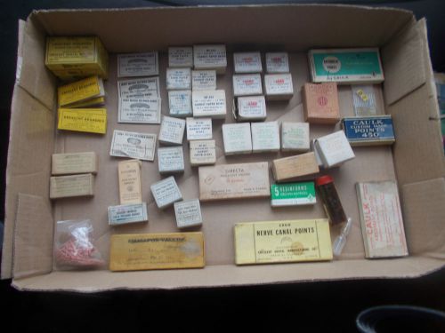 Old dental supplies   about 50 small  boxes/packages cups retainers points disks for sale