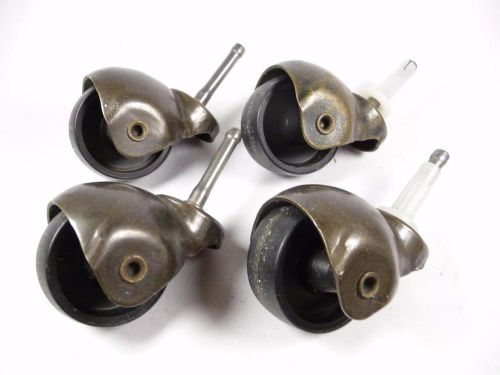 Lot of 4 vintage brass hooded casters 1 3/4&#034; hard plastic wheels grip neck stem for sale