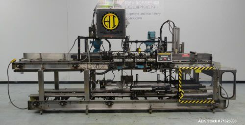 Used- hartness model 825 automatic drop case packer. machine is capable of speed for sale