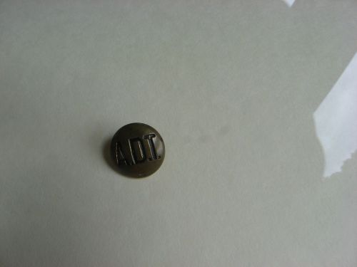 Old adt security systems runner uniform button, brass with adt letters for sale