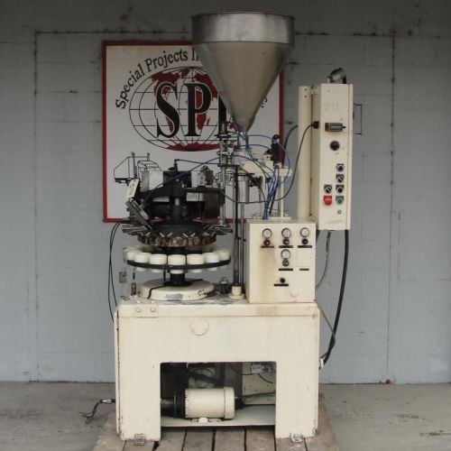 MRM Elgin model E 16 station rotary tube filler and sealer for plastic tubes.