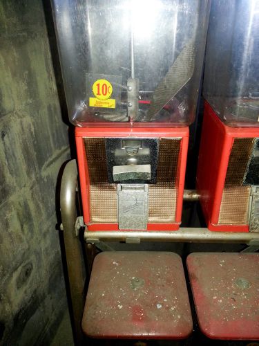 4 NORTHWESTERN CANDY MACHINES ON RACK