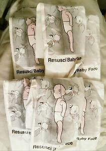 LOT OF 6 NEW LAERDAL RESUSCI ANNE BABY FACES, AIRWAYS EMT EMS CPR INFANT MANIKIN