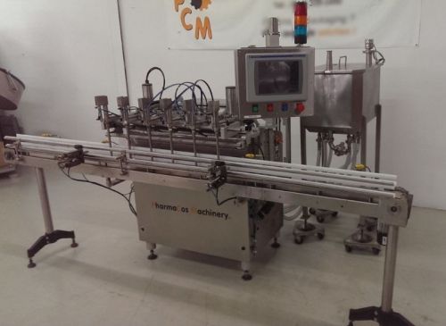 Refurbished kalish 6 head gear pump filler model filltronic with conveyor for sale