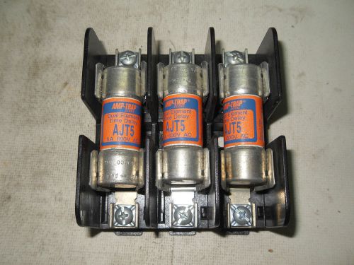 (H3) 1 USED GOULD SHAWMUT 60328SJ FUSE BLOCK W/ 3 USED AMP-TRAP AJT5 FUSES