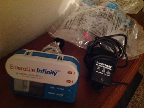 Zevex Enteralite Infinity Feeding Pump w/ pole clamp, p.cord + 3 bags! FREE SHIP