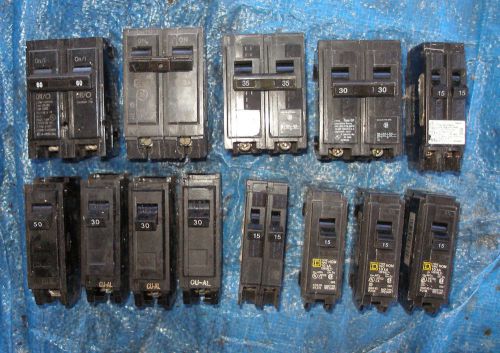 Lot of 15 circuit breakers 15, 30 60, 50 amp ge breakers dual pole  + 220v plug for sale