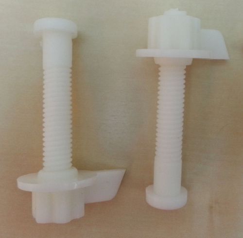 TWO (2) WHITE PLASTIC SCREWS W/CAPS COVERS