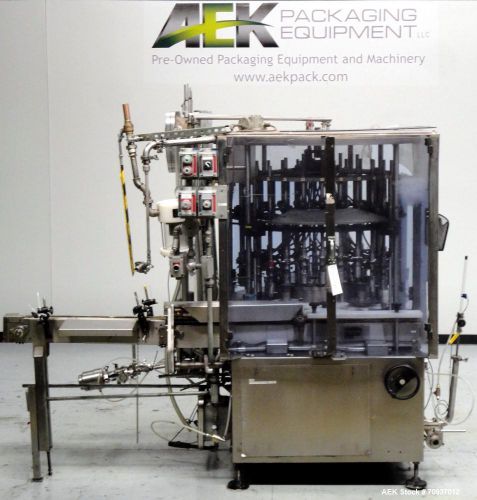 Used- US Bottlers Model VA-28 Rotary Vacuum Liquid Filler. Has 28 heads with fil