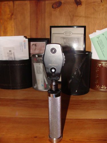 PROPPER OPHTHALMOSCOPE WITH RECHARGEABLE HANDLE AND CARRYING CASE. GOOD CONDITIO