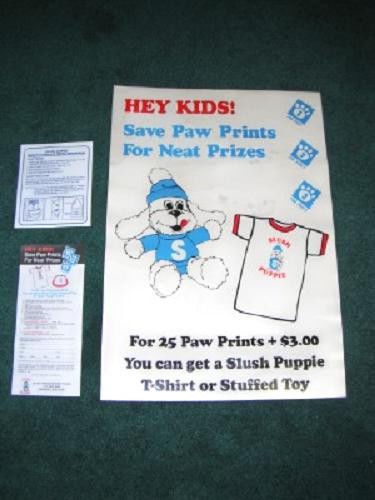 VINTAGE SLUSH PUPPIE ADVERTISING SIGN STUFFED DOG HAT PAW PRINTS OFFER SHIRT