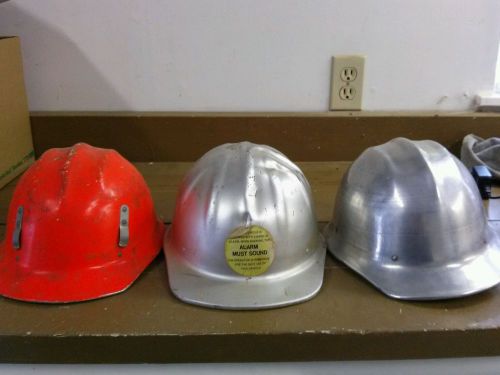 3 metal hard hats