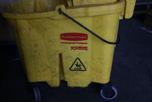 Used yellow wave break  rubbermaid commercial mop bucket 90-7680-a1 &amp; ringer for sale