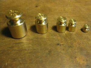 BRASS SET OF 5 OHAIUS BRAND WEIGHTS 50 grams, 20 gm, 10 gm, 5 gm, 2 gm.