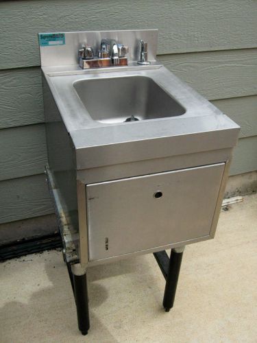 Sink with built-in towel and soap dispensers for sale