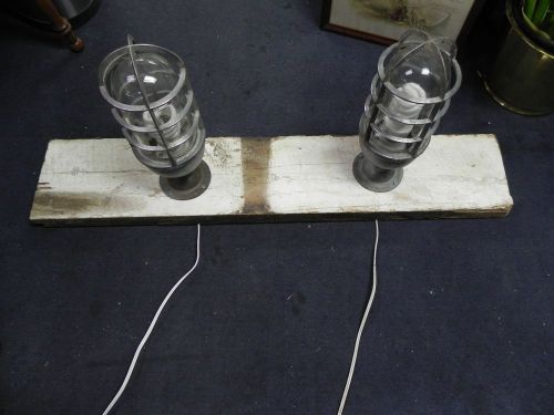 Two Vintage Light Fixture Killark Glass and Gaurd Industrial Light, On Barn Wood