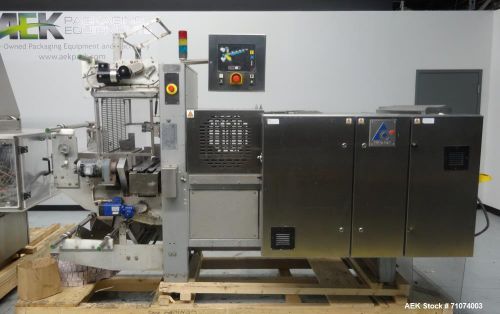 Used- Tetra Pak Model TTS 51 Tray Shrink Bundler. Capable of speeds up to 17 uni