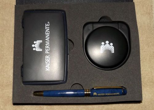 NIB Kaiser Permanente Travel Desk Alarm Clock, Solar Calculator and Pen Set