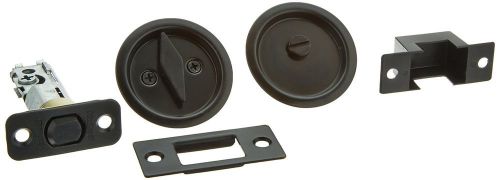 Kwikset 335 Round Bed/Bath Pocket Door Lock in Venetian Bronze